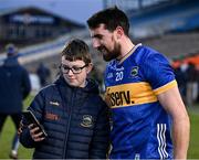 11 February 2024; Patrick Maher of Tipperary with a young supporter after the Allianz Hurling League Division 1 Group B match between Tipperary and Galway at FBD Semple Stadium in Thurles, Tipperary. Photo by Ray McManus/Sportsfile