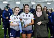 11 February 2024; University of Limerick joint captains Eimear Loughman, left, and Sinead O'Keeffe are presented with the Ashbourne Cup by Camogie Association President, Hilda Breslin,right, after their side's victory in the Electric Ireland Ashbourne Cup final match between University of Limerick and Technological University Dublin at University of Galway Connacht GAA AirDome in Bekan, Mayo. Photo by Sam Barnes/Sportsfile