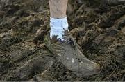 11 February 2024; A detailed view of mucky running spikes during the 123.ie National Intermediate, Masters & Juvenile B Cross Country Championships at DKiT Campus in Dundalk, Louth. Photo by Stephen Marken/Sportsfile