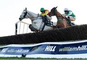 11 February 2024; Young Dev, left, with Daniel King up, jumps the last on their way to winning the William Hill Handicap Steeplechase, from eventual second place Rolly Bowley Boy, right, with Eoin Walsh up, at Navan Racecourse in Meath. Photo by Seb Daly/Sportsfile