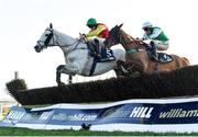 11 February 2024; Young Dev, left, with Daniel King up, jumps the last on their way to winning the William Hill Handicap Steeplechase, from eventual second place Rolly Bowley Boy, right, with Eoin Walsh up, at Navan Racecourse in Meath. Photo by Seb Daly/Sportsfile