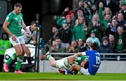 11 February 2024; Dan Sheehan of Ireland scores his side's second try despite the tackle of Ange Capuozzo of Italy during the Guinness Six Nations Rugby Championship match between Ireland and Italy at the Aviva Stadium in Dublin. Photo by Brendan Moran/Sportsfile