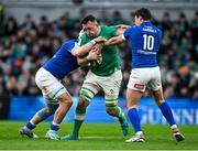 11 February 2024; Jack Conan of Ireland is tackled by Manuel Zuliani and Paolo Garbisi of Italy during the Guinness Six Nations Rugby Championship match between Ireland and Italy at the Aviva Stadium in Dublin. Photo by Brendan Moran/Sportsfile