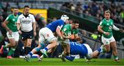 11 February 2024; Robbie Henshaw of Ireland is tackled by Manuel Zuliani and Mirco Spagnolo of Italy during the Guinness Six Nations Rugby Championship match between Ireland and Italy at the Aviva Stadium in Dublin. Photo by Brendan Moran/Sportsfile