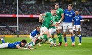 11 February 2024; Jack Crowley of Ireland beats the tackle of Ange Capuozzo of Italy on the way to scoring his side's first try during the Guinness Six Nations Rugby Championship match between Ireland and Italy at the Aviva Stadium in Dublin. Photo by Brendan Moran/Sportsfile