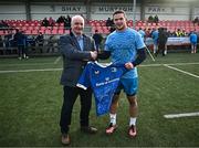 12 February 2024; Scott Penny presents a jersey to Mullingar RFC president Conal Fitzgerald after an open training session on the Leinster Rugby 12 County Tour at Mullingar RFC in Westmeath. Photo by Harry Murphy/Sportsfile