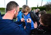 12 February 2024; Leinster supporter Theo Maybury, aged four, from Mullingar, Westemath, has his jersey signed by Ed Byrne during a training session on the Leinster Rugby 12 County Tour at Mullingar RFC in Westmeath. Photo by Harry Murphy/Sportsfile