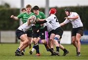 14 February 2024; Shay Ellard of South East is tackled by Midlands players, from left, Alex Begnall, Callum Brennan and Donnacha Ryan during the BearingPoint Shane Horgan Cup Round 4 match between Midlands and South East at Ashbourne RFC in Meath. Photo by Ben McShane/Sportsfile