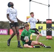 14 February 2024; Zak Hernan of South East scores a try, as Joel Gyasi of Midlands, left, reacts during the BearingPoint Shane Horgan Cup Round 4 match between Midlands and South East at Ashbourne RFC in Meath. Photo by Ben McShane/Sportsfile