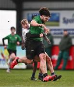 14 February 2024; Joshua Burke of South East is tackled by Alex Begnall of Midlands during the BearingPoint Shane Horgan Cup Round 4 match between Midlands and South East at Ashbourne RFC in Meath. Photo by Ben McShane/Sportsfile