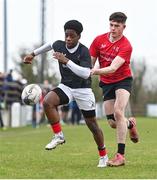 14 February 2024; David Chukwueke of Metro in action against Conor O'Grady of North East during the BearingPoint Shane Horgan Cup Round 4 match between Metro and North East at Ashbourne RFC in Meath. Photo by Ben McShane/Sportsfile