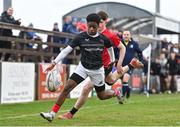 14 February 2024; David Chukwueke of Metro in action against Conor O'Grady of North East during the BearingPoint Shane Horgan Cup Round 4 match between Metro and North East at Ashbourne RFC in Meath. Photo by Ben McShane/Sportsfile