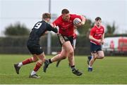 14 February 2024; Tadhg Halpenny of North East in action against Donnachadh Cunningham of Metro during the BearingPoint Shane Horgan Cup Round 4 match between Metro and North East at Ashbourne RFC in Meath. Photo by Ben McShane/Sportsfile
