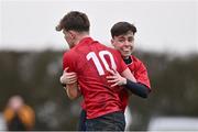 14 February 2024; Lorcan Craik of North East, 10, celebrates with teammate Finn O'Reilly after scoring a try during the BearingPoint Shane Horgan Cup Round 4 match between Metro and North East at Ashbourne RFC in Meath. Photo by Ben McShane/Sportsfile