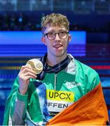 14 February 2024; Daniel Wiffen of Ireland celebrates with his gold medal after winning the Men's 800m freestyle final during day four of the World Aquatics Championships 2024 at the Aspire Dome in Doha, Qatar. Photo by Ian MacNicol/Sportsfile