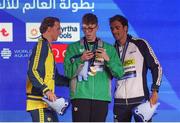 14 February 2024; Daniel Wiffen of Ireland, centre, who won gold, on the podium with Elijah Winnington of Australia, who won silver, and Gregorio Paltrinieri of Italy, who won bronze, after the Men's 800m freestyle final during day four of the World Aquatics Championships 2024 at the Aspire Dome in Doha, Qatar. Photo by Ian MacNicol/Sportsfile