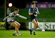 14 February 2024; Aaron Lynch of UCD in action against Charlie Diamond of Ulster University during the Electric Ireland Higher Education GAA Sigerson Cup final match between UCD and Ulster University at Austin Stack Park in Tralee, Kerry. Photo by Brendan Moran/Sportsfile