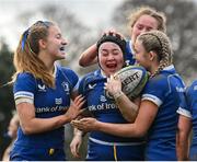 15 February 2024; Lily Byrne of Leinster, centre, is congratulted by teammates, from left, Alex Connor, Rebecca Brennan and Clara Dunne after scoring their side's second try during the U18 Girls Interprovincial semi-final match between Leinster and Munster at Terenure College RFC in Dublin. Photo by Seb Daly/Sportsfile