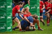 15 February 2024; Kate Noons of Leinster scores her side's third try, despite the tackle of Munster's Lyndsay Clarke, during the U18 Girls Interprovincial semi-final match between Leinster and Munster at Terenure College RFC in Dublin. Photo by Seb Daly/Sportsfile