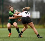 15 February 2024; Emily Foley of Connacht is tackled by Ruby Starrett of Ulster during the U18 Girls Interprovincial semi-final match between Ulster and Connacht at Terenure College RFC in Dublin. Photo by Seb Daly/Sportsfile