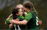 15 February 2024; Emily Foley of Connacht, left, celebrates with teammates Jemima Adams Verling, right, and Ailish Quinn, behind, after scoring their side's third try during the U18 Girls Interprovincial semi-final match between Ulster and Connacht at Terenure College RFC in Dublin. Photo by Seb Daly/Sportsfile