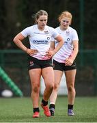 15 February 2024; Ulster players Leah Irwin, left, anmd Erin McConalogue after their side conceded a seventh try during the U18 Girls Interprovincial semi-final match between Ulster and Connacht at Terenure College RFC in Dublin. Photo by Seb Daly/Sportsfile