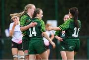 15 February 2024; Saoirse Lawley of Connacht, 14, celebrates with teammates Emily Foley, right, and Ailish Quinn after scoring their side's seventh try during the U18 Girls Interprovincial semi-final match between Ulster and Connacht at Terenure College RFC in Dublin. Photo by Seb Daly/Sportsfile