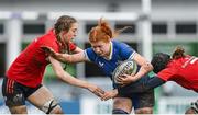 15 February 2024; Isobel O'Sullivan of Leinster is tackled by Munster players Aoife Grimes, left, and Clodagh O’Keeffe during the U18 Girls Interprovincial semi-final match between Leinster and Munster at Terenure College RFC in Dublin. Photo by Seb Daly/Sportsfile