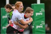 15 February 2024; Amy McConkey of Ulster, right, celebrates with teammate Erin McConalogue after scoring their side's third try during the U18 Girls Interprovincial semi-final match between Ulster and Connacht at Terenure College RFC in Dublin. Photo by Seb Daly/Sportsfile
