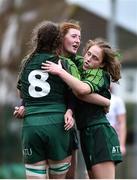15 February 2024; Connacht players, from left, Jemima Adams Verling, Jemma Lees, and Aisling Whyte celebrate at the final whistle after their side's victory in the U18 Girls Interprovincial semi-final match between Ulster and Connacht at Terenure College RFC in Dublin. Photo by Shauna Clinton/Sportsfile