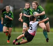 15 February 2024; Sarah Purcell of Connacht is tackled by Natalie Turner of Ulster during the U18 Girls Interprovincial semi-final match between Ulster and Connacht at Terenure College RFC in Dublin. Photo by Seb Daly/Sportsfile
