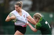 15 February 2024; Cara McLean of Ulster is tackled by Ailish Quinn of Connacht during the U18 Girls Interprovincial semi-final match between Ulster and Connacht at Terenure College RFC in Dublin. Photo by Seb Daly/Sportsfile