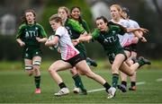 15 February 2024; Amy McConkey of Ulster evades the tackle of Connacht's Meabh Flannery on her way to scoring her side's third try during the U18 Girls Interprovincial semi-final match between Ulster and Connacht at Terenure College RFC in Dublin. Photo by Seb Daly/Sportsfile