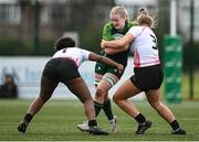 15 February 2024; Ailish Quinn of Connacht is tackled by Ulster players Grace Simati, left, and Sophie McAllister during the U18 Girls Interprovincial semi-final match between Ulster and Connacht at Terenure College RFC in Dublin. Photo by Seb Daly/Sportsfile