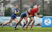 15 February 2024; Niamh Crotty of Munster is tackled by Clara Dunne of Leinster during the U18 Girls Interprovincial semi-final match between Leinster and Munster at Terenure College RFC in Dublin. Photo by Seb Daly/Sportsfile