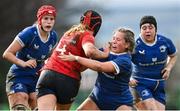 15 February 2024; Sally Kelly of Munster is tackled by Kate Noons of Leinster during the U18 Girls Interprovincial semi-final match between Leinster and Munster at Terenure College RFC in Dublin. Photo by Seb Daly/Sportsfile
