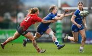15 February 2024; Caoimhe McCormack of Leinster in action against Lyndsay Clarke of Munster during the U18 Girls Interprovincial semi-final match between Leinster and Munster at Terenure College RFC in Dublin. Photo by Seb Daly/Sportsfile