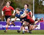 15 February 2024; Caoimhe McCormack of Leinster is tackled by Mia Hennelly of Munster during the U18 Girls Interprovincial semi-final match between Leinster and Munster at Terenure College RFC in Dublin. Photo by Shauna Clinton/Sportsfile