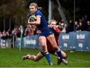15 February 2024; Clara Dunne of Leinster is tackled by Mia Hennelly of Munster during the U18 Girls Interprovincial semi-final match between Leinster and Munster at Terenure College RFC in Dublin. Photo by Shauna Clinton/Sportsfile