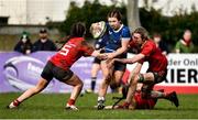 15 February 2024; Emma Brogan of Leinster is tackled by Meghan Crilly, left, and Aoife Grimes of Munsterduring the U18 Girls Interprovincial semi-final match between Leinster and Munster at Terenure College RFC in Dublin. Photo by Shauna Clinton/Sportsfile