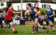 15 February 2024; Sadhbh Furlong of Leinster evades the tackle of Munster's Meghan Crilly during the U18 Girls Interprovincial semi-final match between Leinster and Munster at Terenure College RFC in Dublin. Photo by Shauna Clinton/Sportsfile