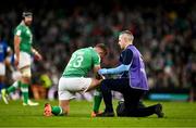 11 February 2024; Jordan Larmour of Ireland recieves medical attention during the Guinness Six Nations Rugby Championship match between Ireland and Italy at the Aviva Stadium in Dublin. Photo by Ben McShane/Sportsfile
