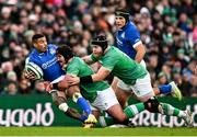 11 February 2024; Monty Ieone of Italy is tackled by James Lowe, centre, and Tom O'Toole of Ireland during the Guinness Six Nations Rugby Championship match between Ireland and Italy at the Aviva Stadium in Dublin. Photo by Ben McShane/Sportsfile
