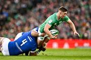 11 February 2024; Jack Crowley of Ireland is tackled by Niccolo Cannone, 4, and Danilo Fischetti of Italy during the Guinness Six Nations Rugby Championship match between Ireland and Italy at the Aviva Stadium in Dublin. Photo by Ben McShane/Sportsfile