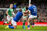 11 February 2024; Jack Conan of Ireland is tackled by Pietro Ceccarelli, left, and Tommaso Menoncello of Italy during the Guinness Six Nations Rugby Championship match between Ireland and Italy at the Aviva Stadium in Dublin. Photo by Ben McShane/Sportsfile