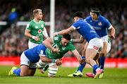 11 February 2024; Jack Conan of Ireland is tackled by Pietro Ceccarelli, left, and Tommaso Menoncello of Italy during the Guinness Six Nations Rugby Championship match between Ireland and Italy at the Aviva Stadium in Dublin. Photo by Ben McShane/Sportsfile