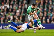 11 February 2024; Robbie Henshaw of Ireland is tackled by Juan Ignacio Brex of Italy during the Guinness Six Nations Rugby Championship match between Ireland and Italy at the Aviva Stadium in Dublin. Photo by Ben McShane/Sportsfile