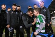 16 February 2024; Josh Honohan and his Shamrock Rovers team-mates meet Shamrock Rovers supporter Cian Smyth before the SSE Airtricity Men's Premier Division match between Shamrock Rovers and Dundalk at Tallaght Stadium in Dublin. Photo by Stephen McCarthy/Sportsfile