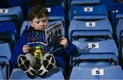 16 February 2024; Waterford supporter Fionn Hearn, aged 10, from Waterford City, reads the match programme before the SSE Airtricity Men's Premier Division match between Waterford and Shelbourne at the Regional Sports Centre in Waterford. Photo by Harry Murphy/Sportsfile