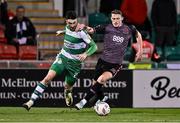 16 February 2024; Neil Farrugia of Shamrock Rovers in action against Zak Bradshaw of Dundalk during the SSE Airtricity Men's Premier Division match between Shamrock Rovers and Dundalk at Tallaght Stadium in Dublin. Photo by Ben McShane/Sportsfile
